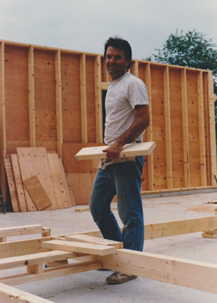 Bill Huston, age 36, begins construction of his new furniture workshop, 1987