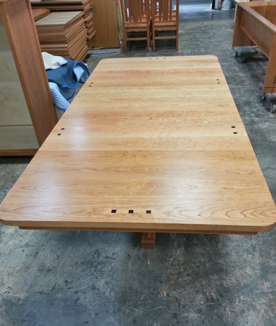 Completed custom Gates Extension Table in the Huston and Company furniture workshop