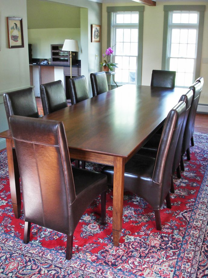 Custom Element Table, rectangular, in walnut with wenge details.