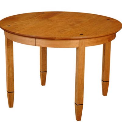 Element Table, round. Shown in cherry with wenge details.